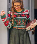 Woman wearing Nuts About Fall squirrel sweater with green skirt and vintage styling 