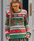 Woman wearing women's squirrel sweater with acorns maple leaves and mushrooms