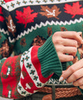 Close-up of women's cotton Fair Isle sweater with maple leaves and woodland pattern