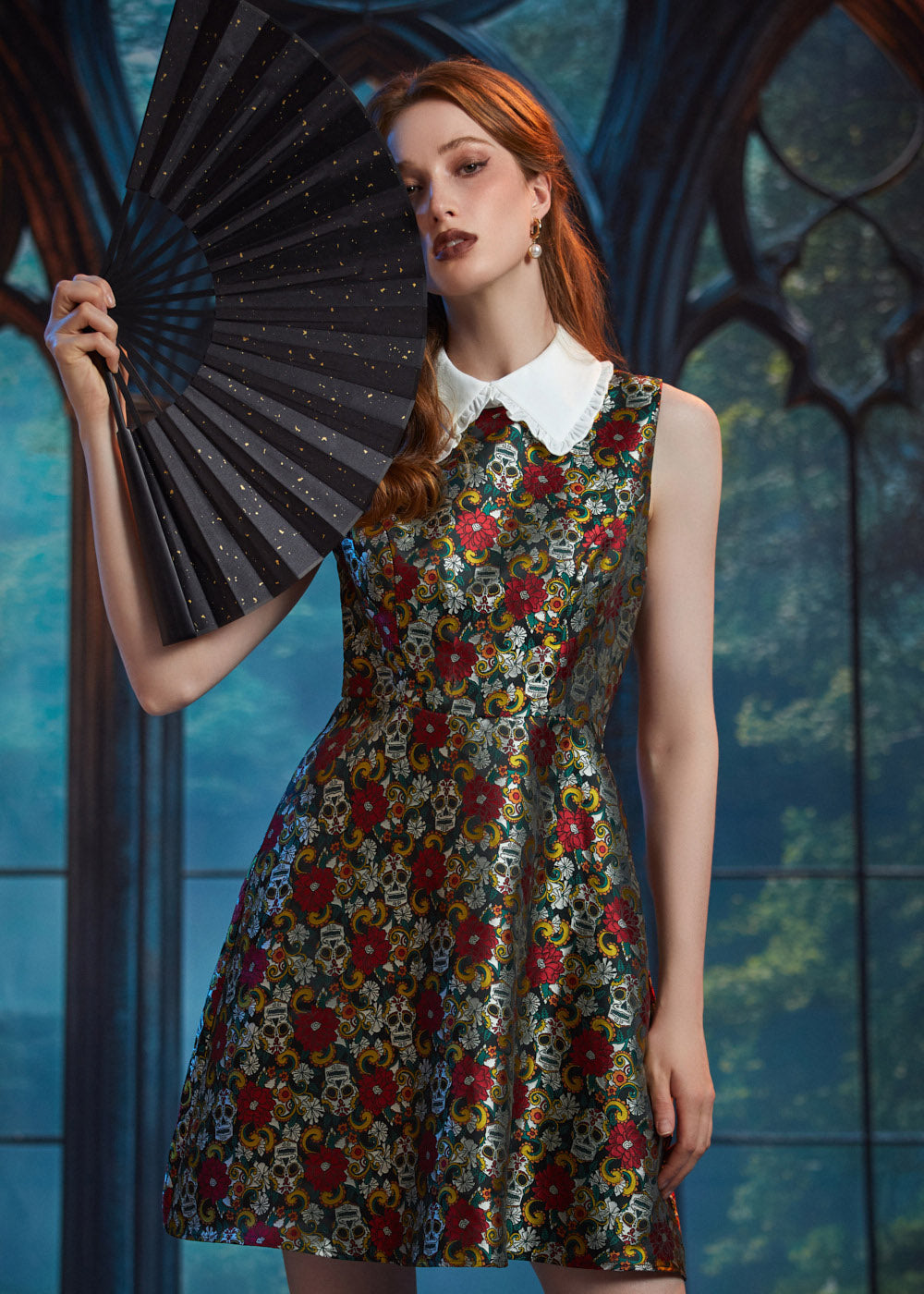 Woman wearing ModCloth Forever Remembered Dress in Memento Mori featuring a sleeveless fit-and-flare silhouette, ruffled Peter Pan collar, and textured brocade fabric.