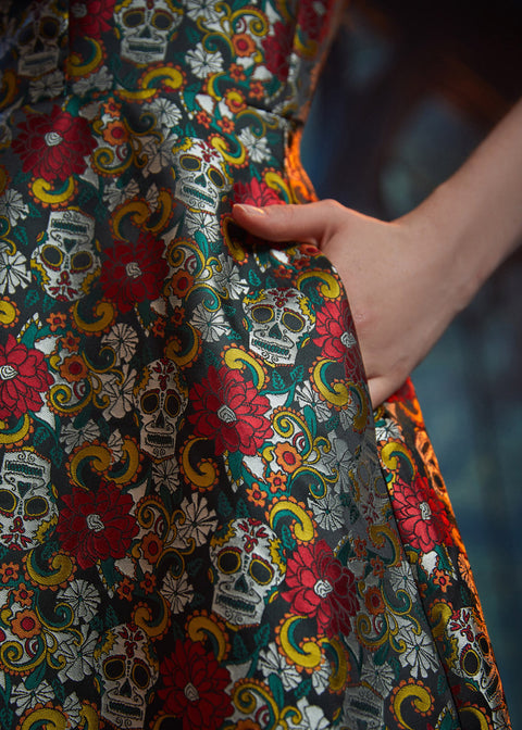 Close-up of the side seam pocket on the Forever Remembered Dress highlighting the textured floral brocade fabric.