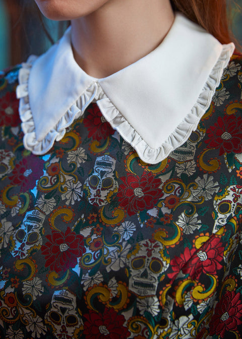 Close-up of the ruffled Peter Pan collar on the Forever Remembered Dress showcasing the richly textured floral brocade.