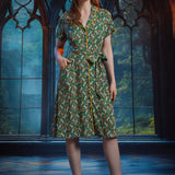 Woman wearing vintage-inspired button-front midi shirt dress with shawl collar, contrast piping, and pockets.