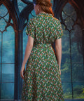 Back view of ModCloth Going Out And About midi dress in Toadally Bewitched with vintage-inspired silhouette.