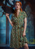 Woman wearing ModCloth Going Out And About button-front midi dress in Toadally Bewitched frog and mushroom print with removable tie belt.