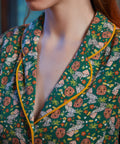 Close-up of shawl collar with yellow contrast piping on ModCloth Going Out And About dress in Toadally Bewitched.