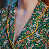 Close-up of shawl collar with yellow contrast piping on ModCloth Going Out And About dress in Toadally Bewitched.