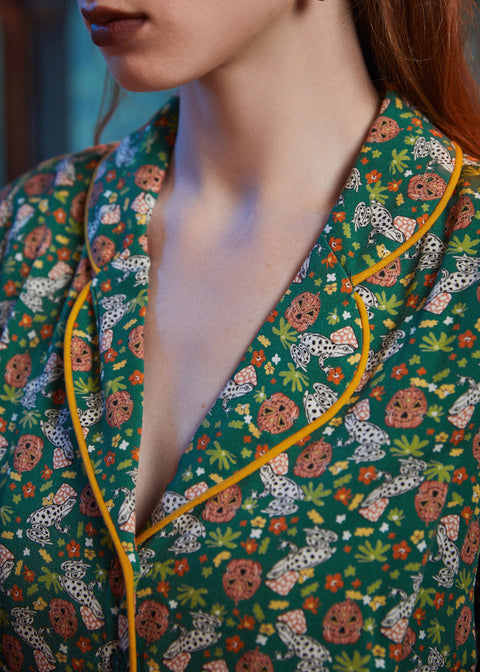 Close-up of shawl collar with yellow contrast piping on ModCloth Going Out And About dress in Toadally Bewitched.