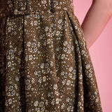 Matching buckle belt detail on olive floral ModCloth dress
