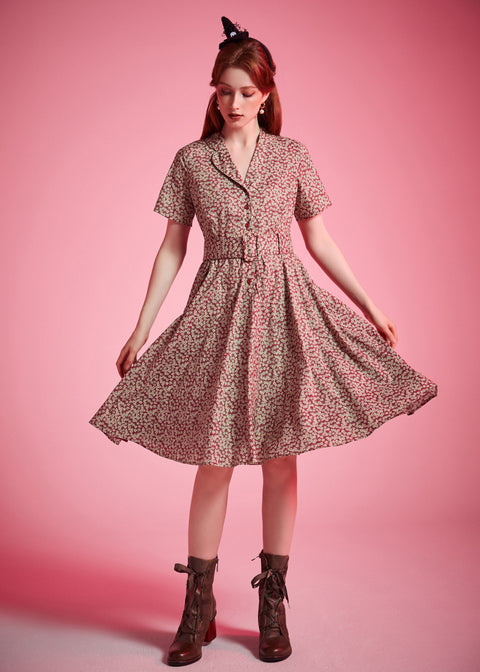 Vintage-inspired burgundy floral dress with full gathered skirt and short sleeves