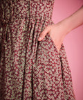 Burgundy floral cotton fit-and-flare dress with button-front bodice and side pockets