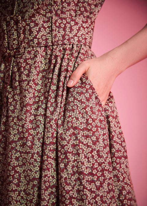 Burgundy floral cotton fit-and-flare dress with button-front bodice and side pockets