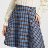 Studio close-up of blue and brown plaid Sailor Flare Skirt showing high waist, double button rows and flared silhouette