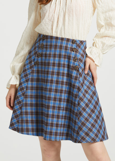 Studio close-up of blue and brown plaid Sailor Flare Skirt showing high waist, double button rows and flared silhouette