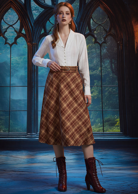 Full-length view woman wearing the ModCloth Turning the Page brown plaid midi skirt with white blouse, braided belt and burgundy boots