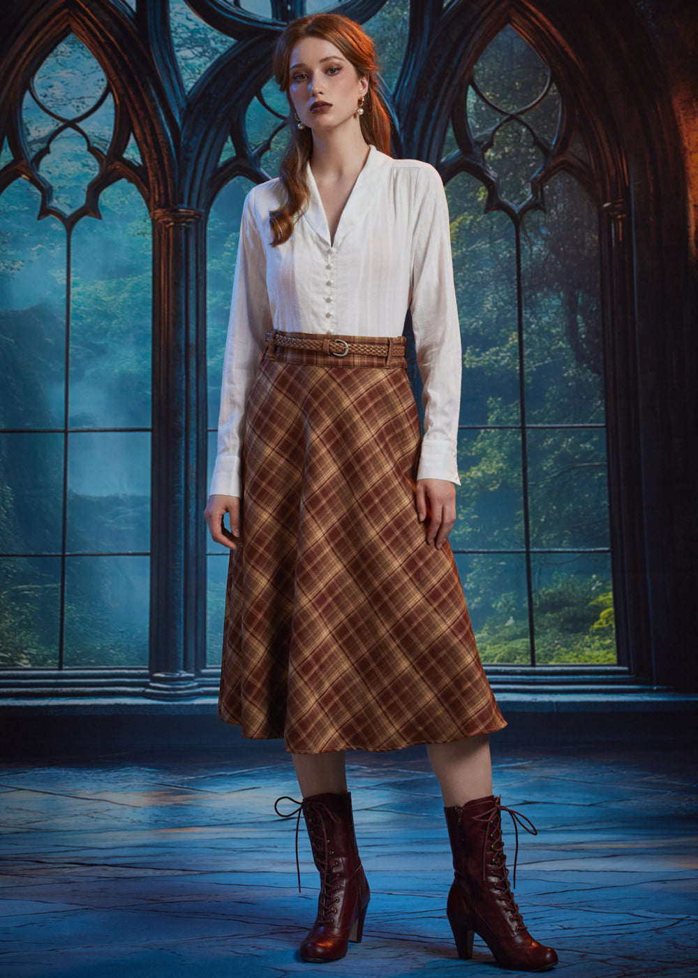 Full-length view woman wearing ivory vintage-inspired blouse with brown plaid midi skirt and lace-up boots