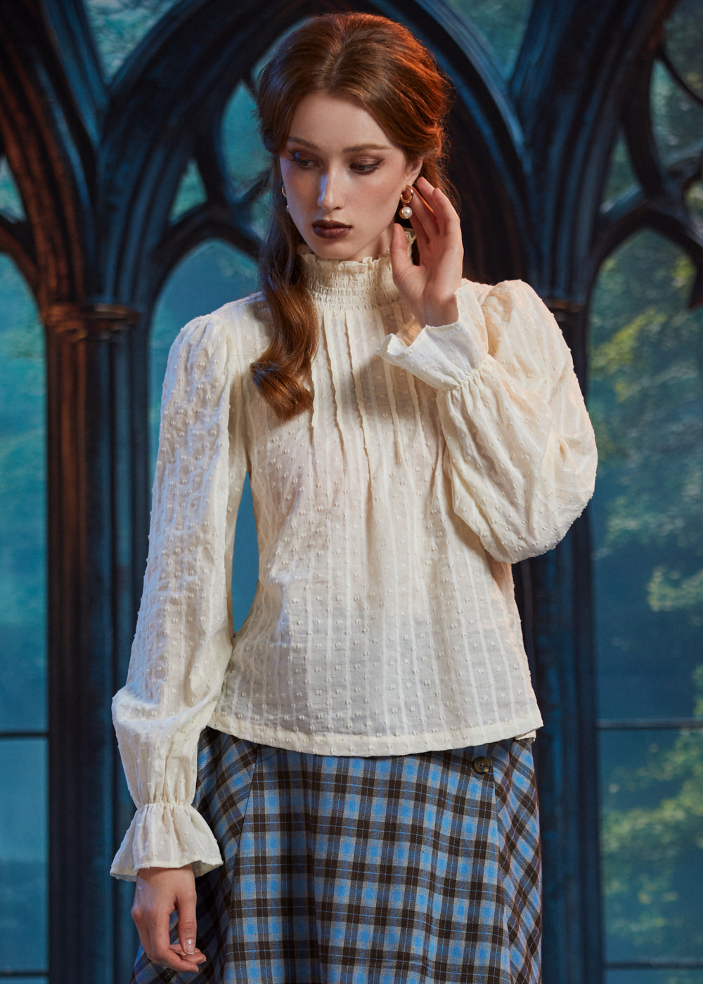 Woman wearing textured cotton-blend poet blouse with pintucked front, smocked neckline and long ruffle-cuff sleeves