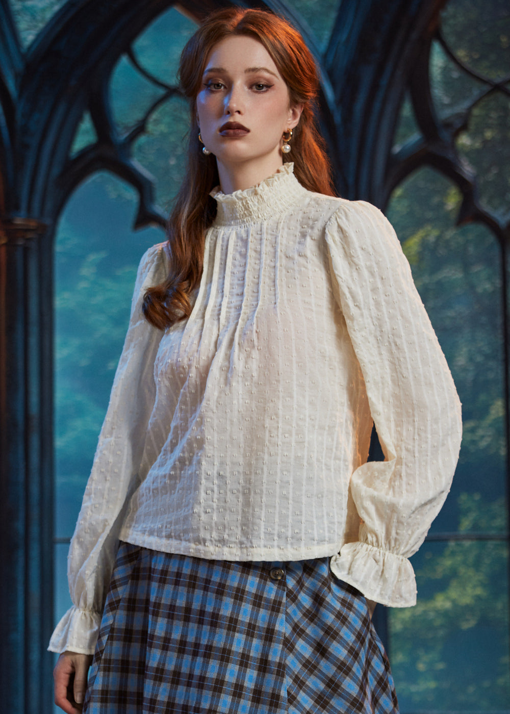 Woman wearing Poetry in Motion cream color blouse with high ruffled neckline and softly gathered long sleeves