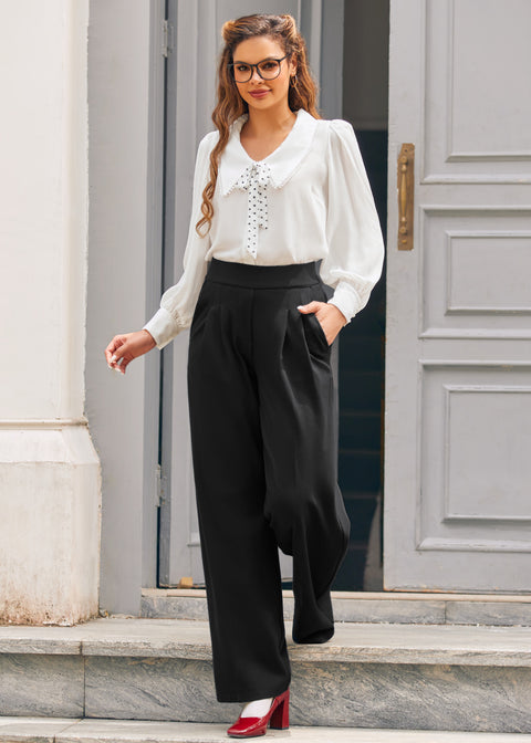 Full-length view of woman wearing ivory tie neck blouse with black wide-leg trousers and red heels