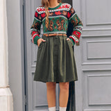 Woman wearing vintage-inspired olive corduroy skirt with sweater for fall