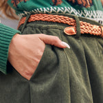 Women's olive green corduroy skirt with high waist, front pleats and buttons
