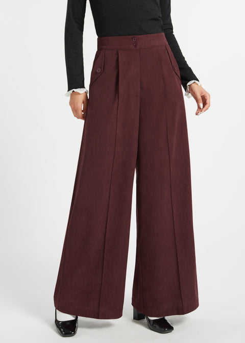 Front view of woman wearing Mahogany Wine corduroy pants showing high waist, wide legs, pleats and side pocket