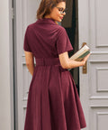 Back view of burgundy corduroy shirt dress with matching waist belt