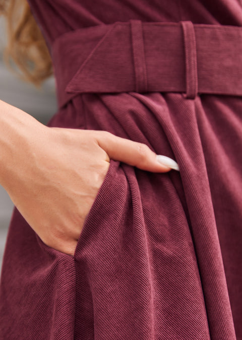 Burgundy corduroy dress side pocket and fabric-covered belt detail