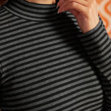 Close-up of black and heather-gray striped rib-knit top showing the mock neckline and cotton stretch fabric