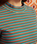 Close-up of the ribbed mock neckline and multicolor horizontal stripes on the Whispers of Autumn cotton top