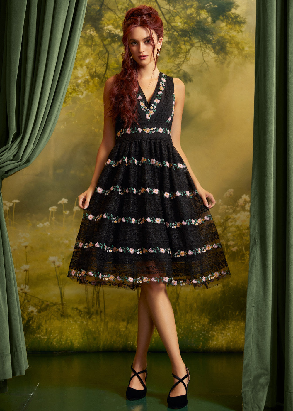 Full-length front view of The Vivienne V-Neck Dress styled with black crisscross-strap heels, highlighting the fitted bodice and flared knee-length skirt.