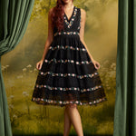 Full-length front view of The Vivienne V-Neck Dress styled with black crisscross-strap heels, highlighting the fitted bodice and flared knee-length skirt.