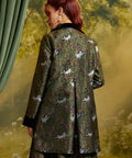 Back view of the Eloise Empire Waist Coat showing the empire waist seam, center back pleat, and whimsical white cat and foliage print.