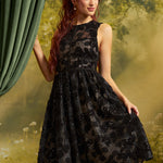 Front view of The Estelle Sequin Fit & Flare Dress in Black Dahlia, featuring black floral lace, sparkling sequins, a fitted sleeveless bodice, and a full midi skirt.