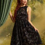 Front view of The Estelle Sequin Fit & Flare Dress in Black Dahlia, featuring black floral lace, sparkling sequins, a fitted sleeveless bodice, and a full midi skirt.