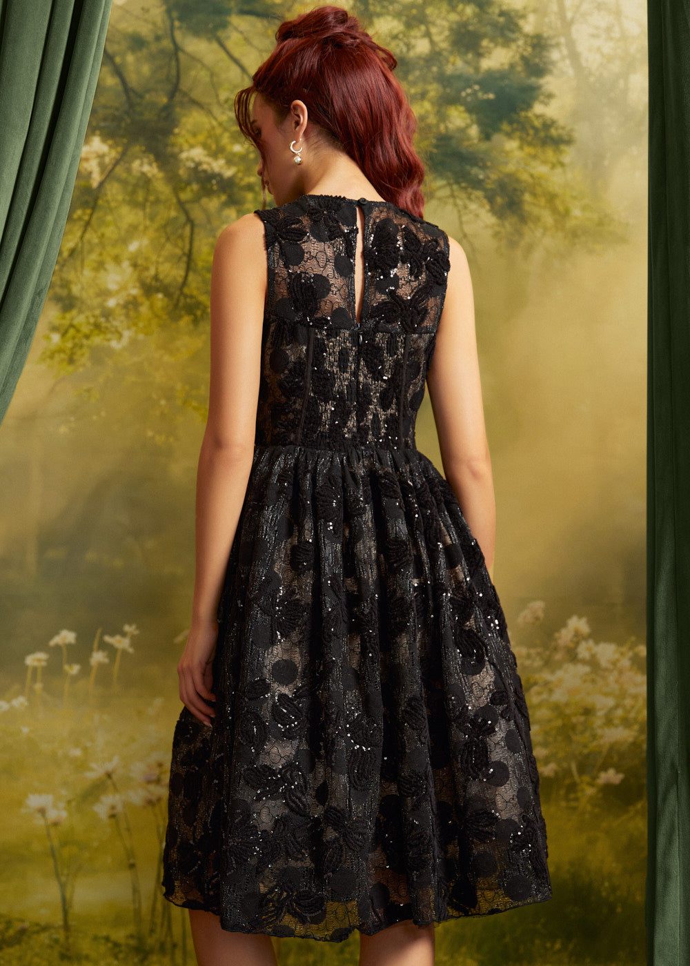 Back view of The Estelle Sequin Fit & Flare Dress showing the sleeveless bodice, defined waist, and full black lace midi skirt.