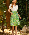 Woman wearing ModCloth The Garden Stroll Skirt in Hide & Squeak styled with a white Peter Pan collar blouse for a vintage-inspired spring outfit.