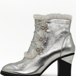 Silver metallic ankle boot with lace-up design on a white background