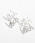 Silver 'bitch' earrings on a white background