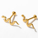 Pair of gold snake-shaped earrings on a white background