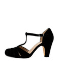 Black high-heeled shoe with a T-strap on a white background