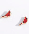 Red bird-shaped earrings on a white background
