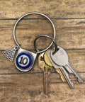 Keychain with keys on a wooden surface