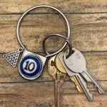 Keychain with keys on a wooden surface