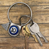 Keychain with keys on a wooden surface