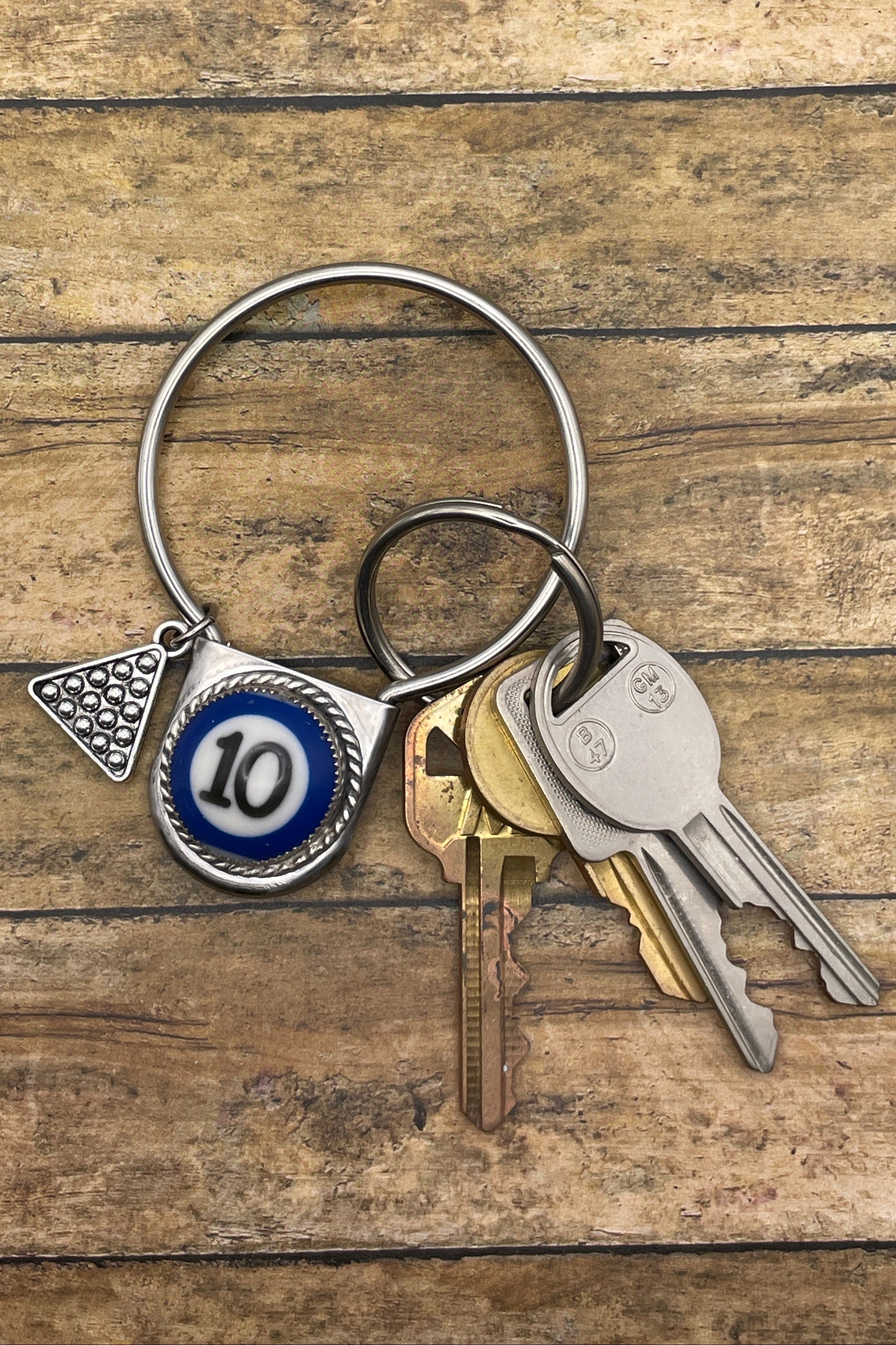 Keychain with keys on a wooden surface