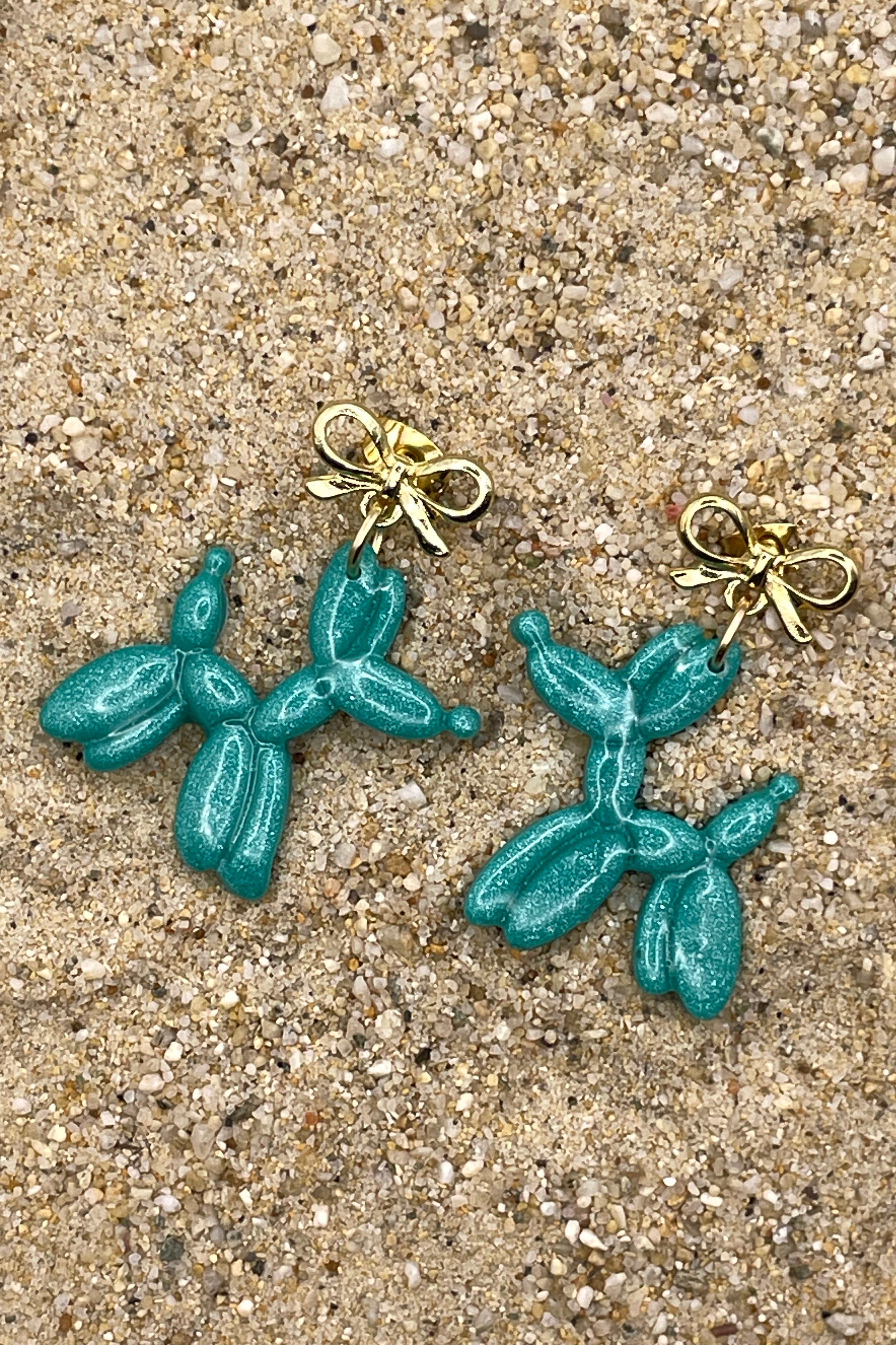 Teal balloon animal earrings