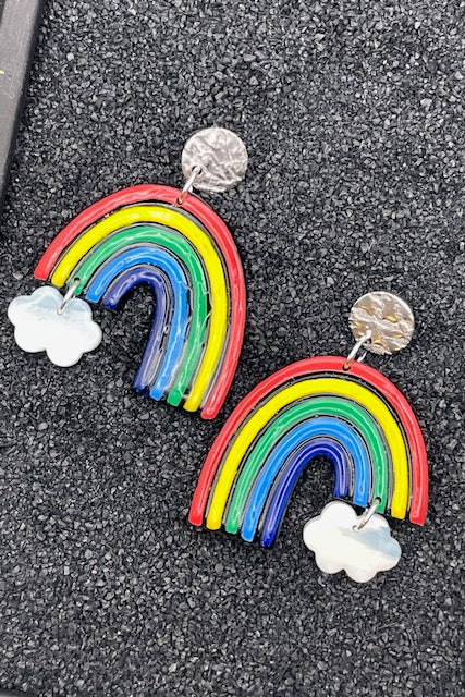 Colorful rainbow-shaped earrings with cloud designs on a black background