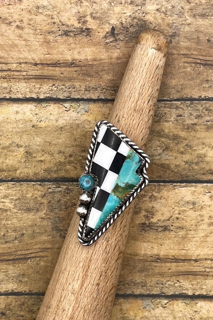 Lightning bold shaped artisan made sterling silver ring with checkered design and turquoise stone