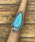 Artisan made sterling silver ring with teardrop Kingman blue Turquoise gemstone.
